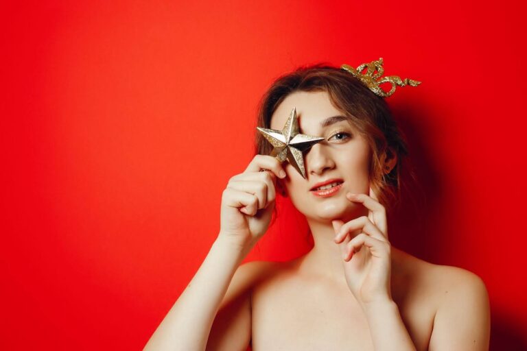 man steaming shirt in bathroom to remove wrinkles