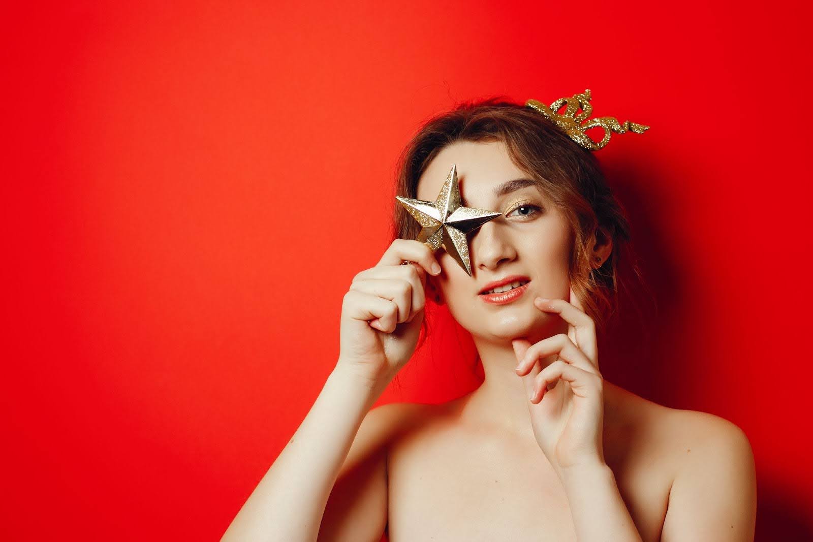 man steaming shirt in bathroom to remove wrinkles
