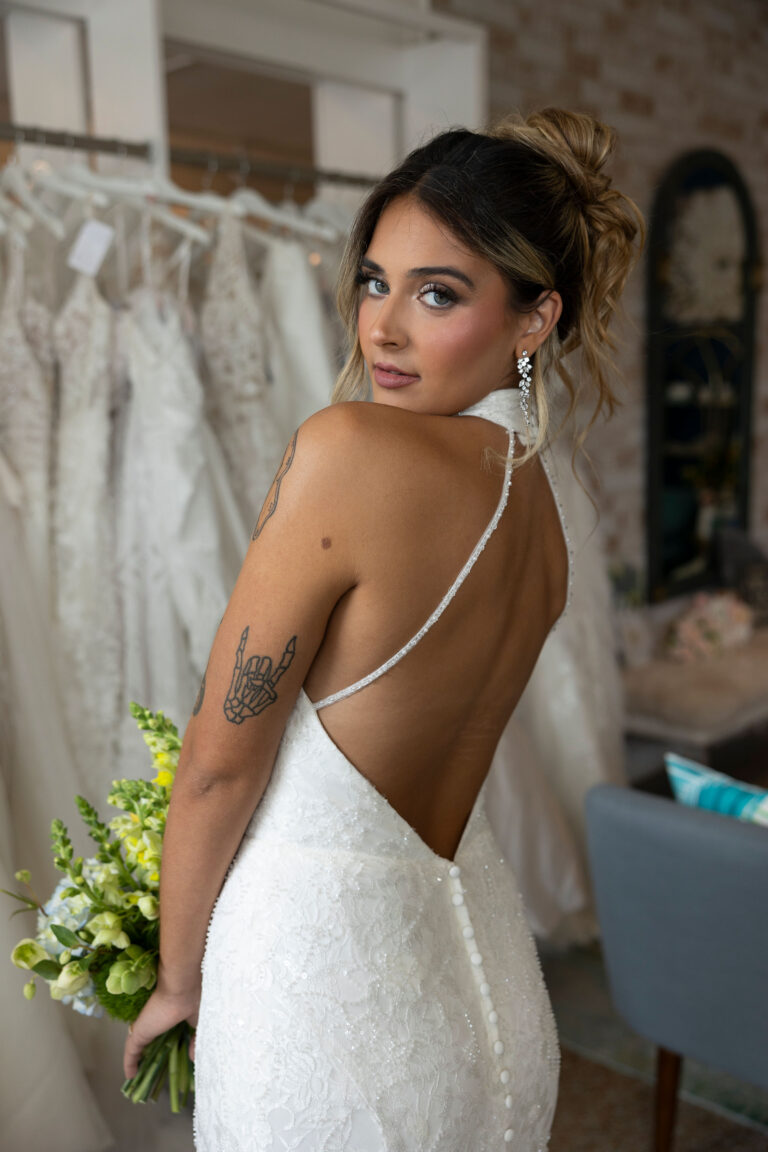 Airy black slip dress styled for daytime with sneakers